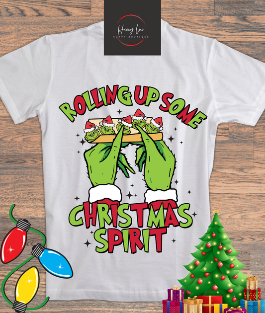 Rolling up Grinch Red and Green Tee