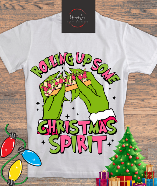 Rolling up Grinch Pink and Green Tee